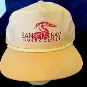 San Luis Bay golf course hat, pink with white rope.